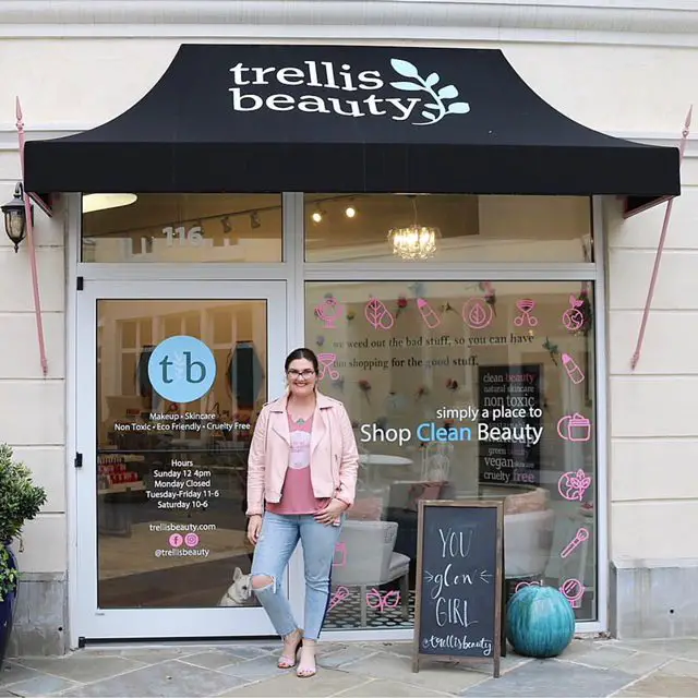 My Cancer Chic Blogger Anna Crollman shares clean beauty detox - in photo: woman standing outside a beauty store