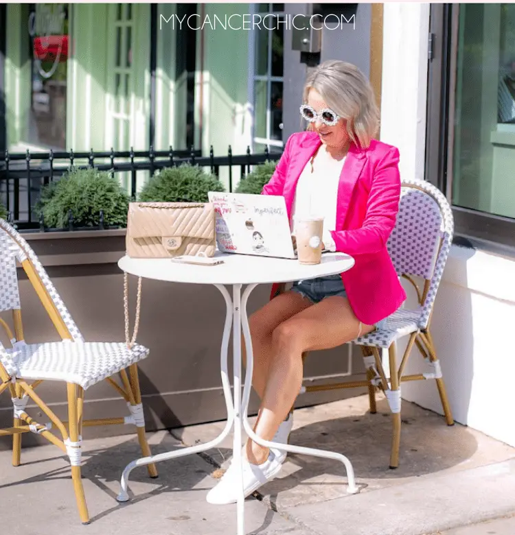 woman working outside with her laptop and sharing how to manage Screen Time Fatigue