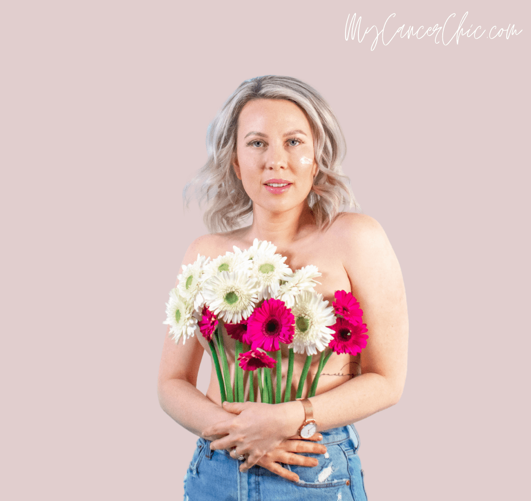 Woman with flower shirt wearing jeans and la roche posay facial sunscreen