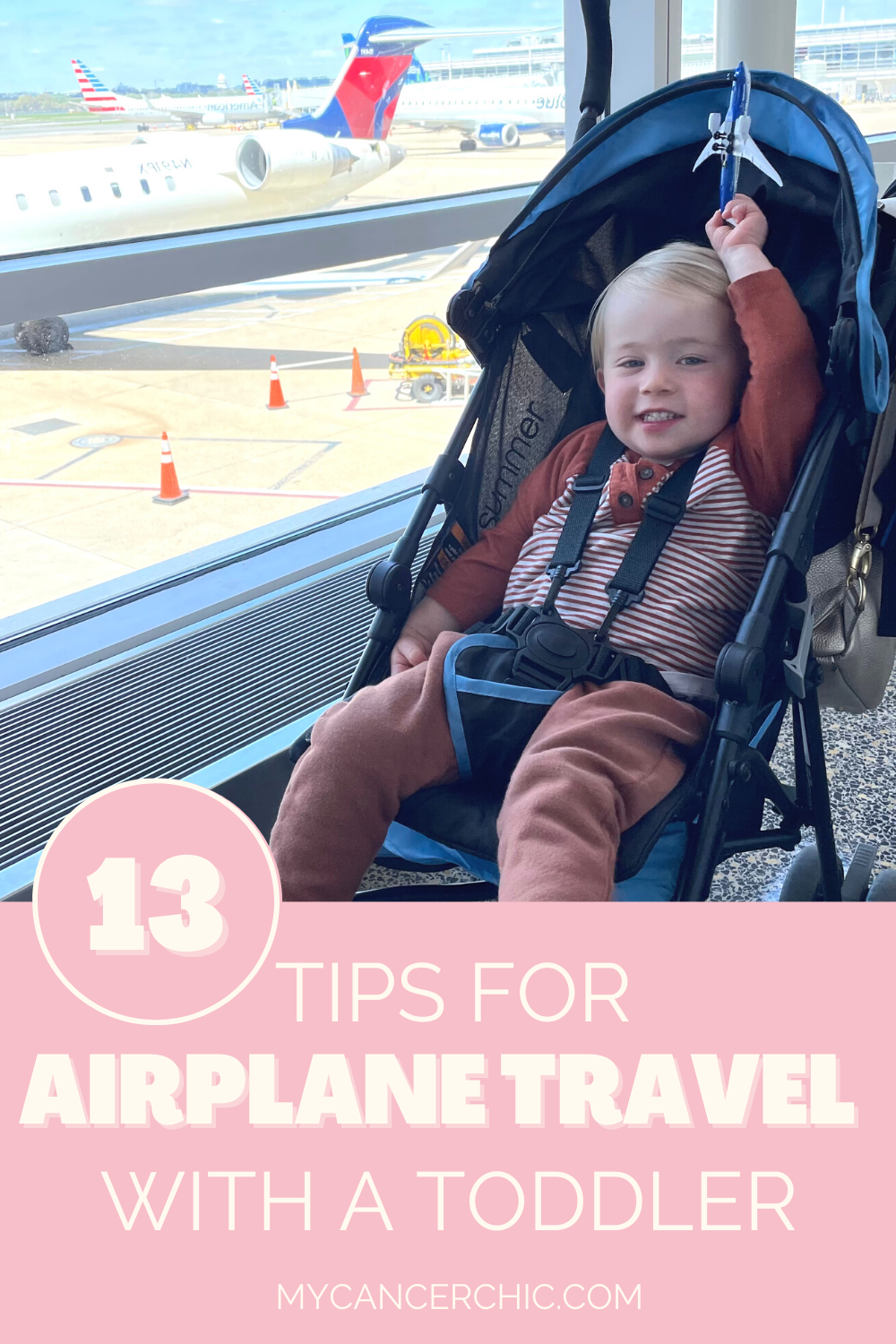 toddler in a stroller at the airport - traveling with a toddler on a plane tips