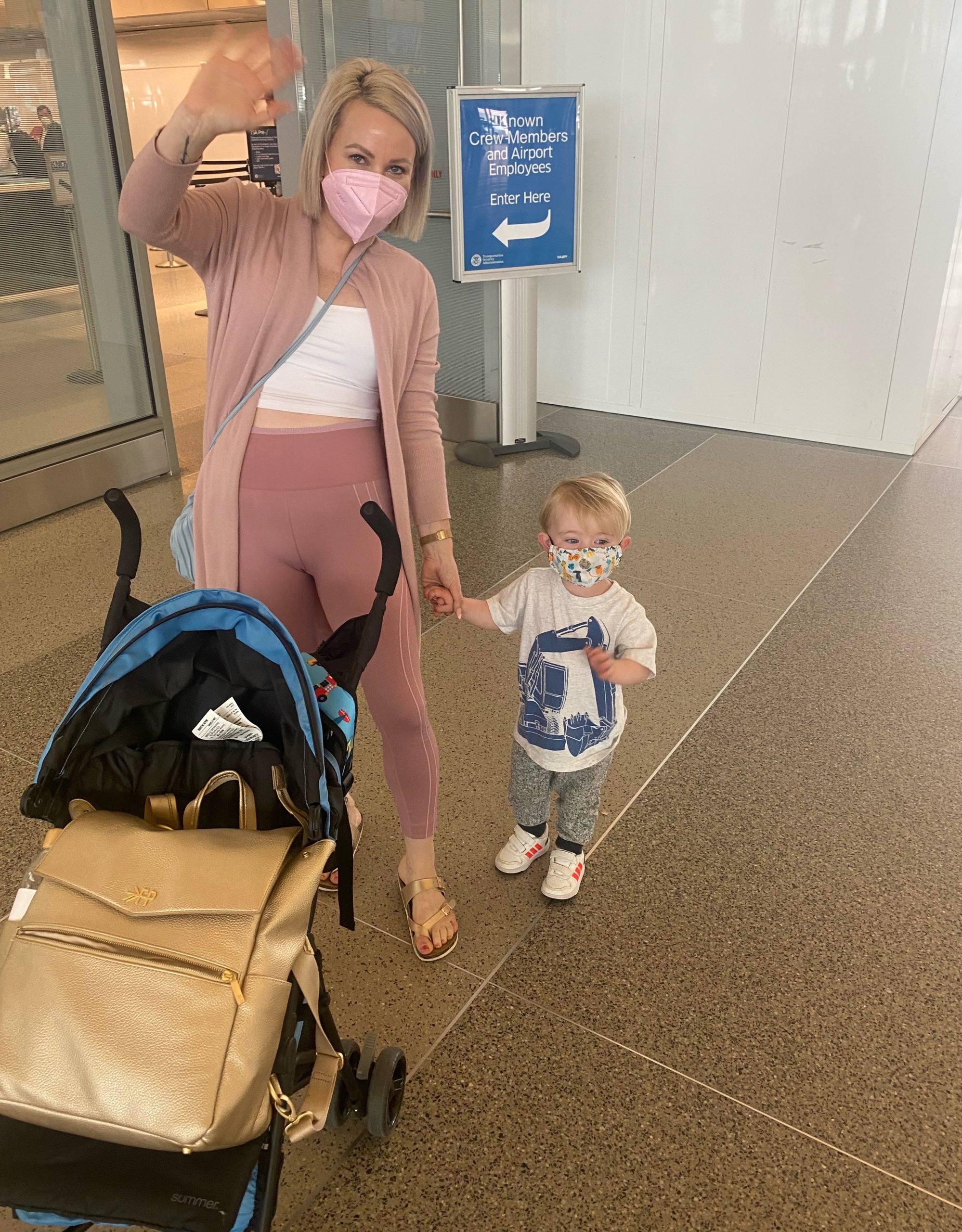 traveling with a toddler on a plane -waving goodbye