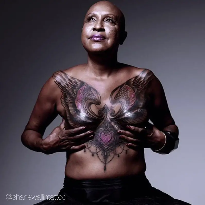 breast cancer double mastectomy tattoo beautiful large angel wings with elaborate tattoo design on bald black woman