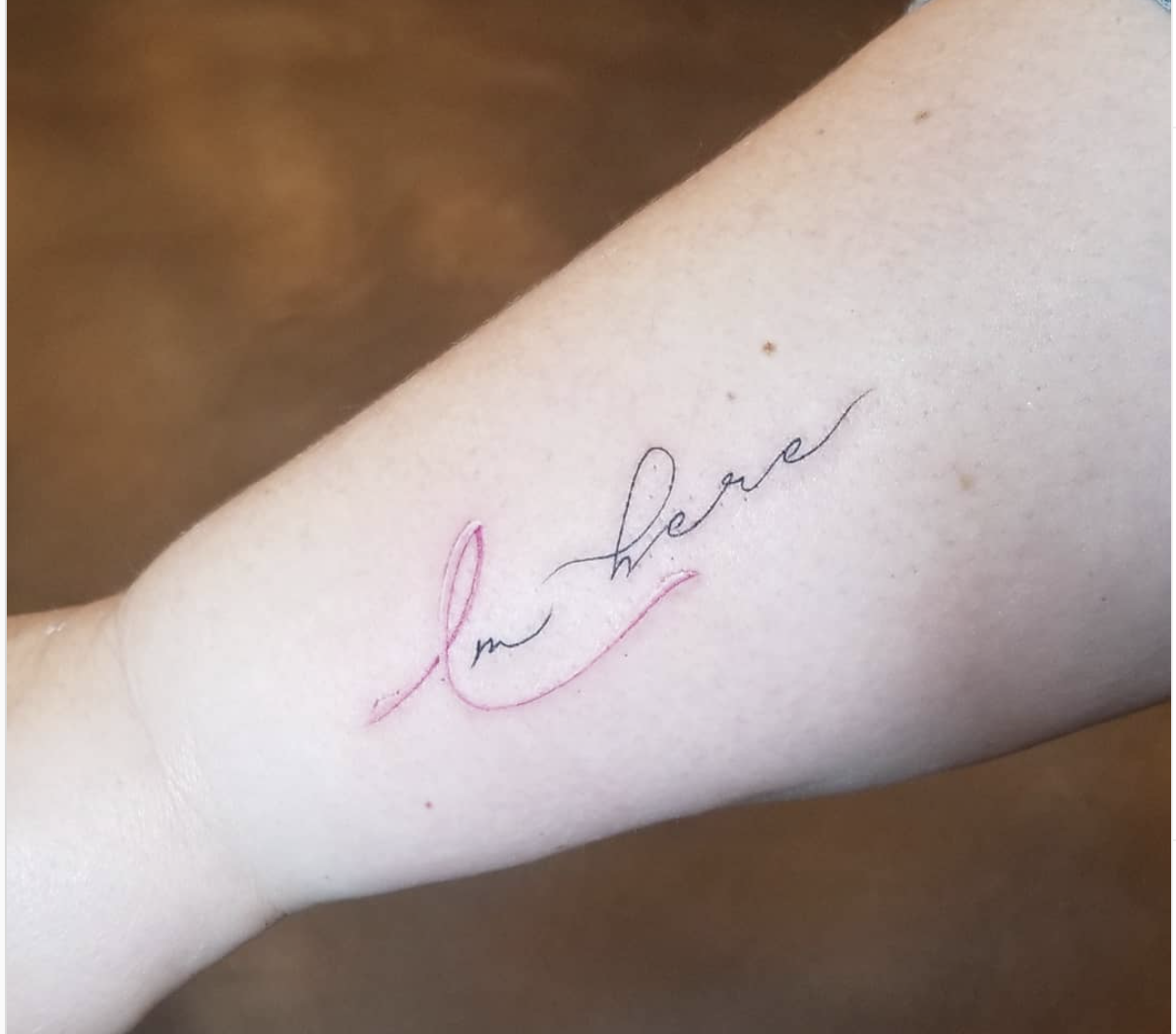 "I'm here" breast cancer tattoo with pink script