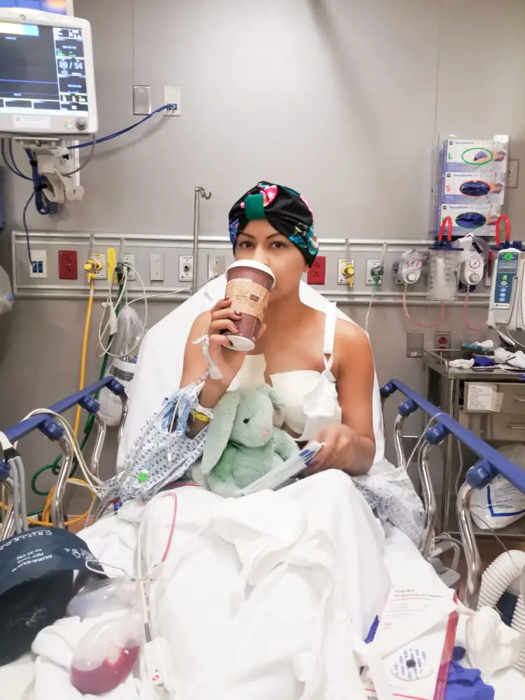 My Cancer Chic Blogger Anna Crollman shares restoring body image after breast cancer - in photo: woman in the hospital drinking coffee
